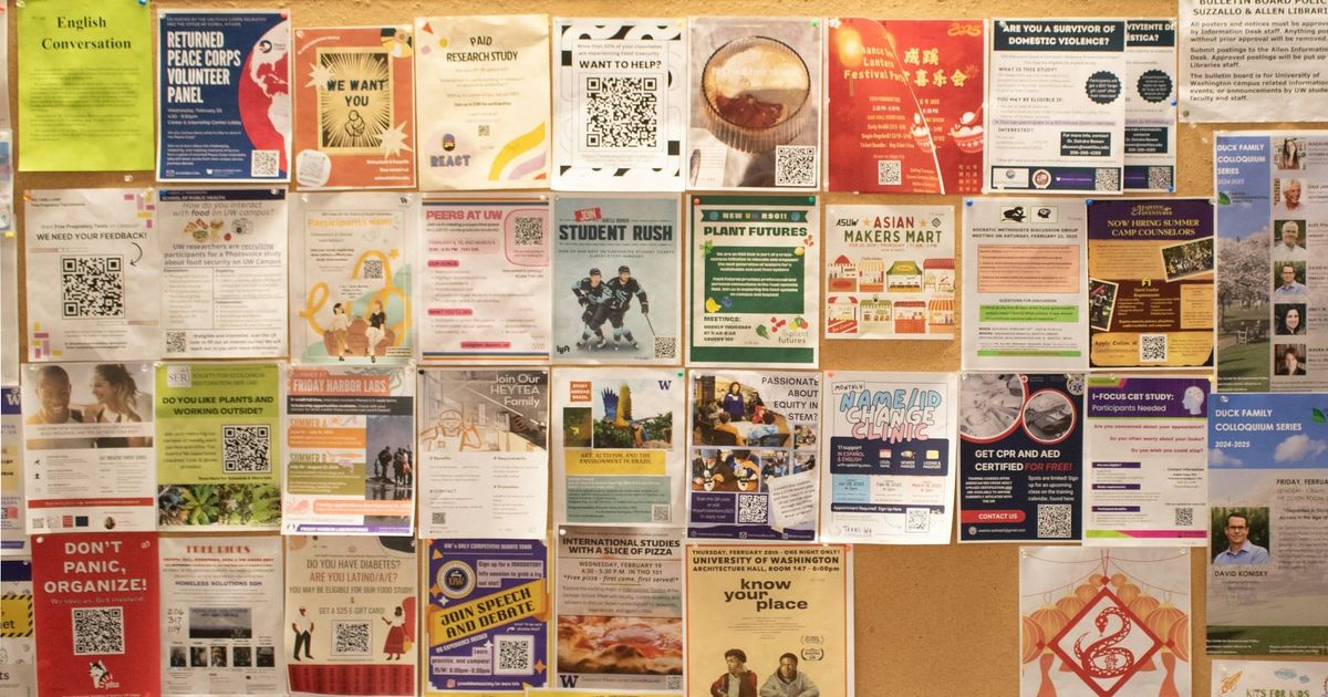 A corkboard covered in flyers and notices