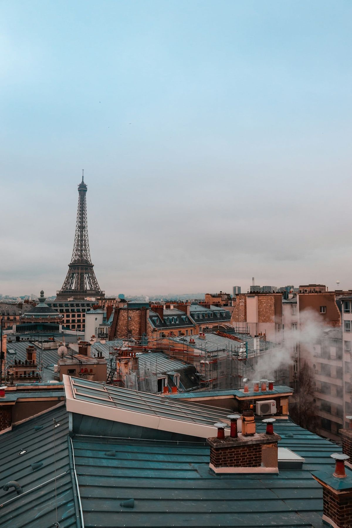 Paris rooftops with the Eiffel Tower in the distance