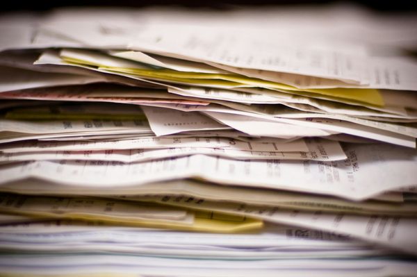 A close-up of a stack of white papers