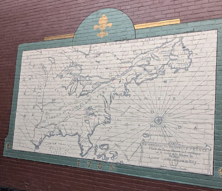 photo: old timey map of 'Le Canada Du Nouvelle France' on a brick wall from 1705