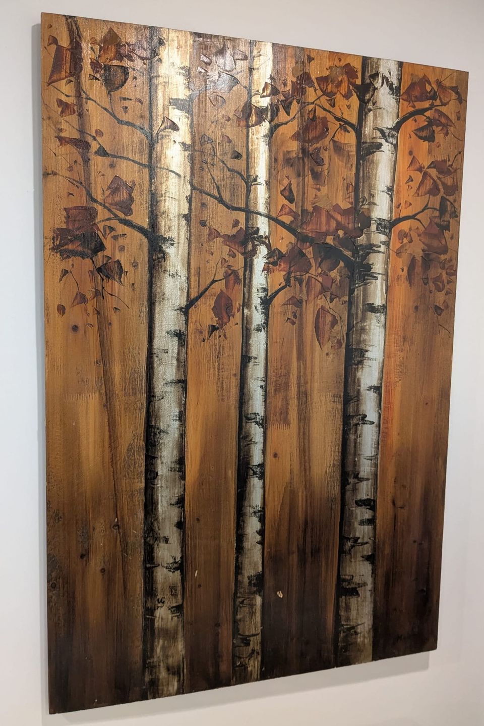 photo: wood panel art at a weird angle on a white wall