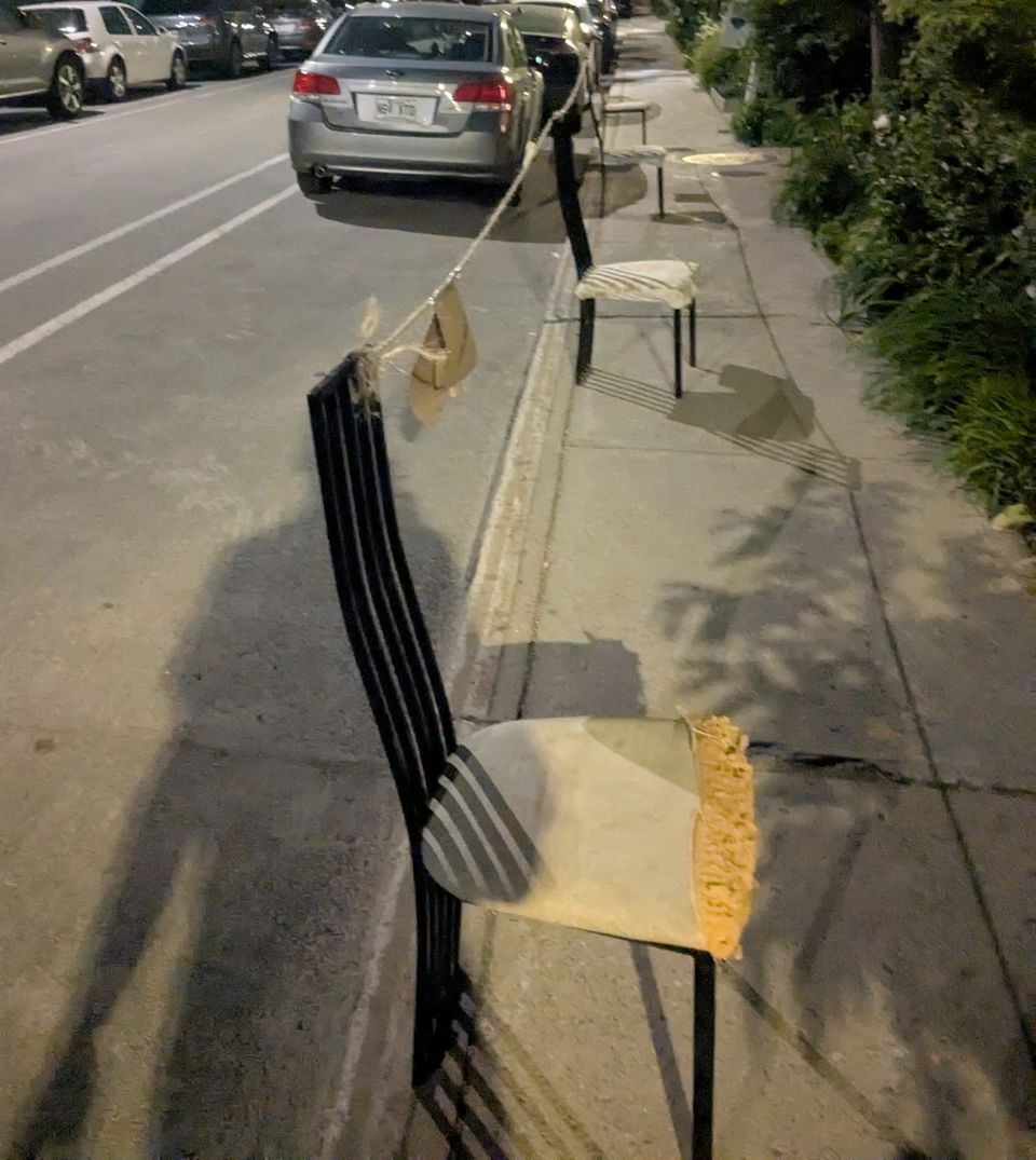photphoto: 'Montreal Dibs': chairs on a sidewalk with a rope tied between them to mark off a parking spot