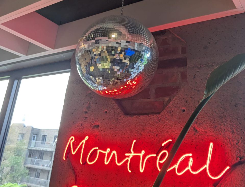 photo: disco ball over a neon sign "Montreal"