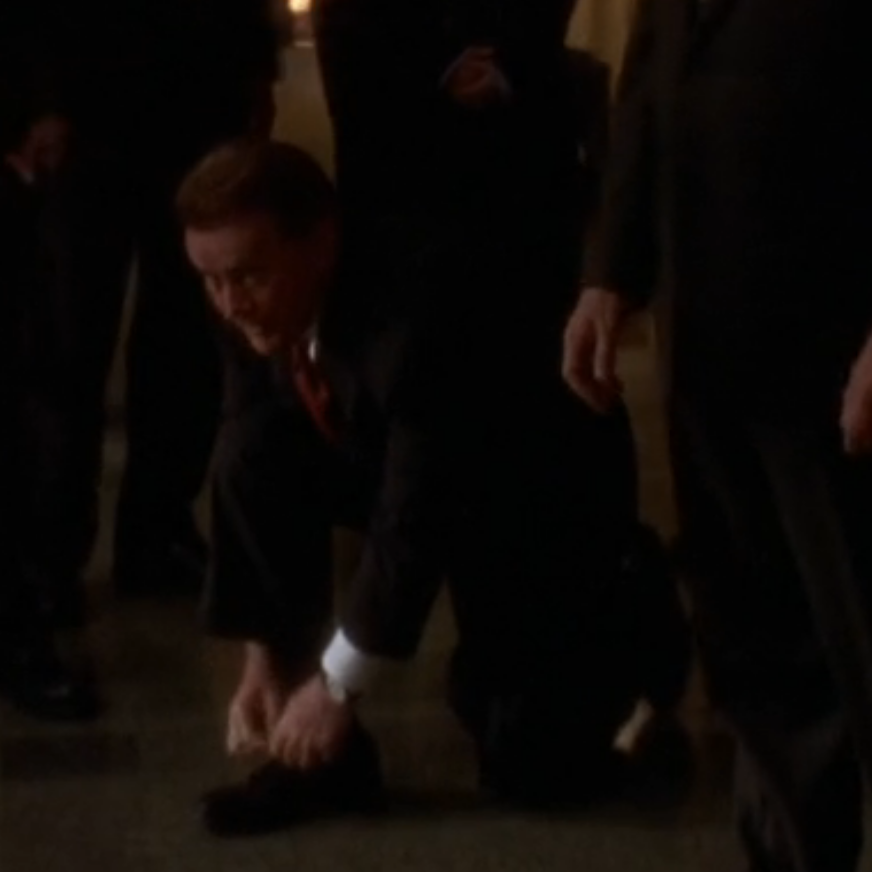 photo: screenshot from the West Wing, Martin Sheen as President Jed Bartlett, tying his shoes, probably winning an Emmy for it