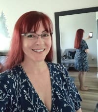 Photo of a 57 year old woman showing how long her hair is for Skippy