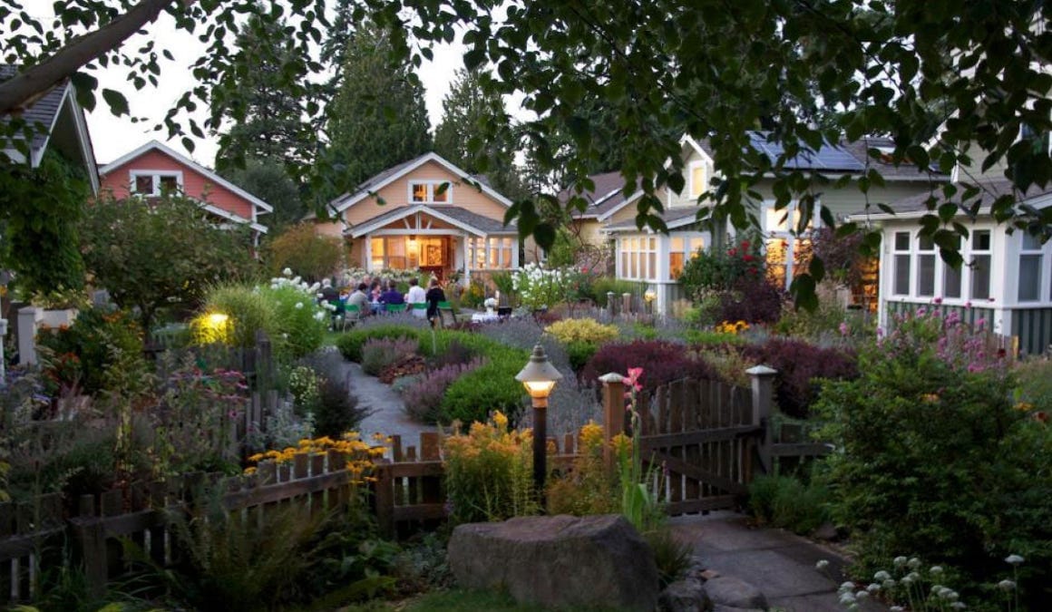 Small cottages arranged around a shared garden
