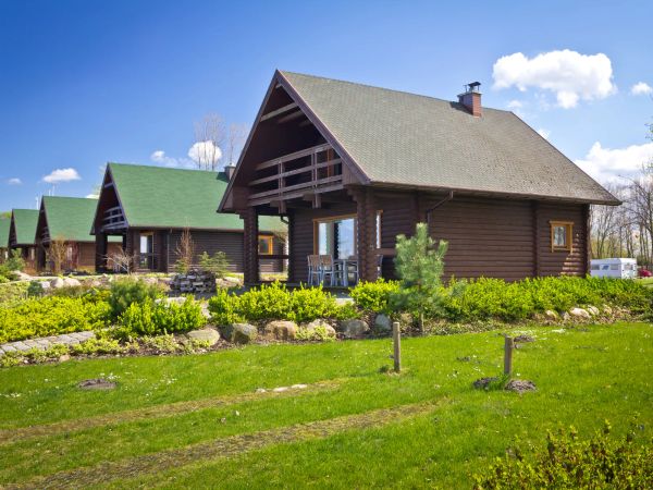 A row of log cabins.