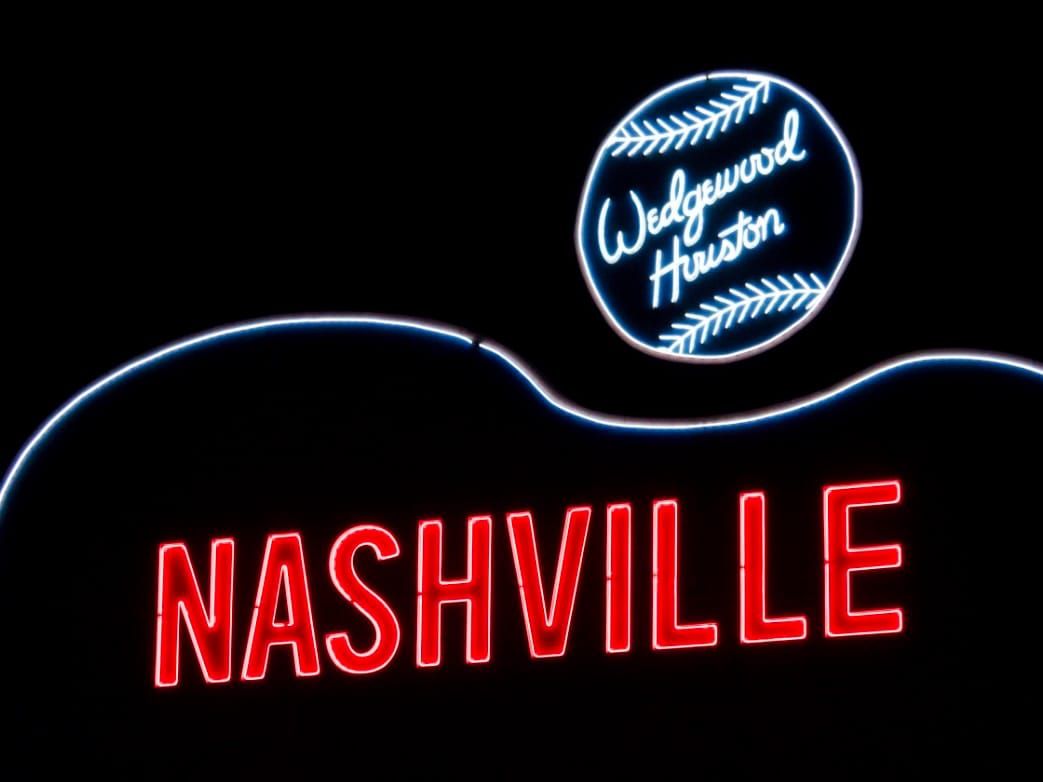 The Nashville sign in Wedgewood-Houston, glowing red and white after dark.