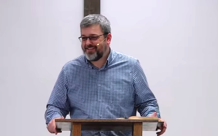 Pastor Jake Reid preaching from 1 Corinthians 12 at Easton Baptist Church