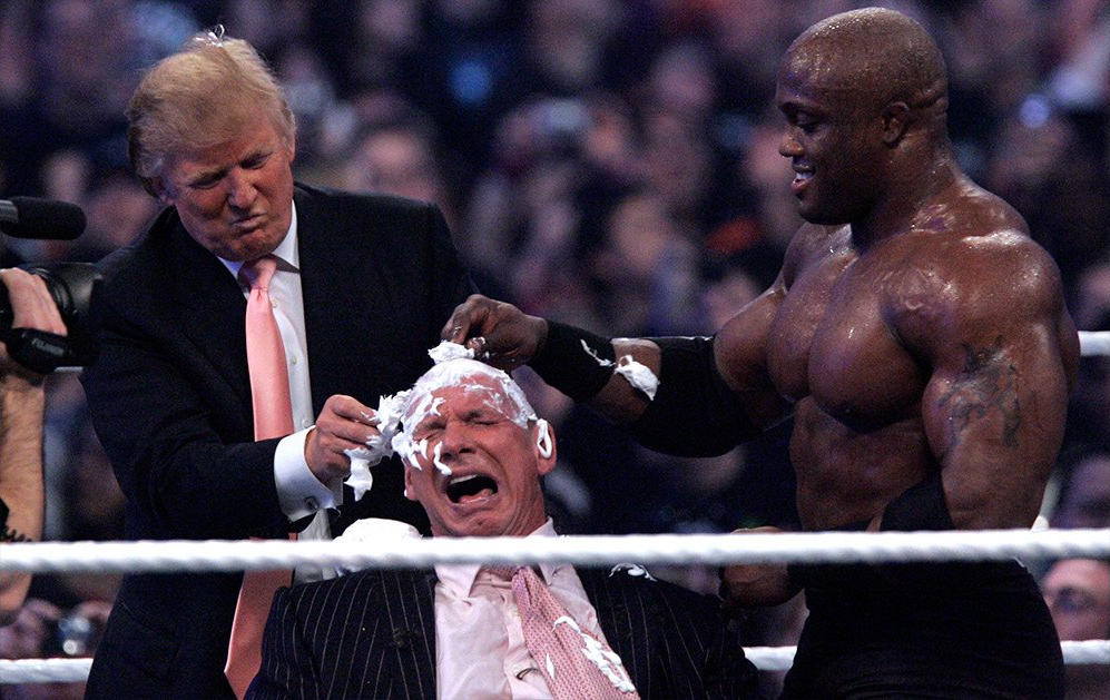 Donald Trump shaving Vince McMahon's head in a WWE ring