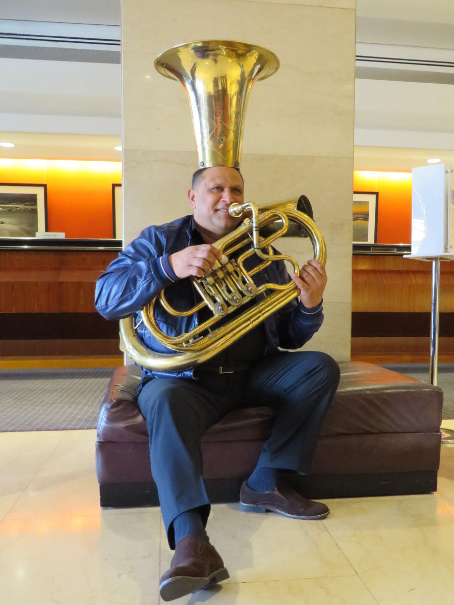 Monel with portion of tuba on head