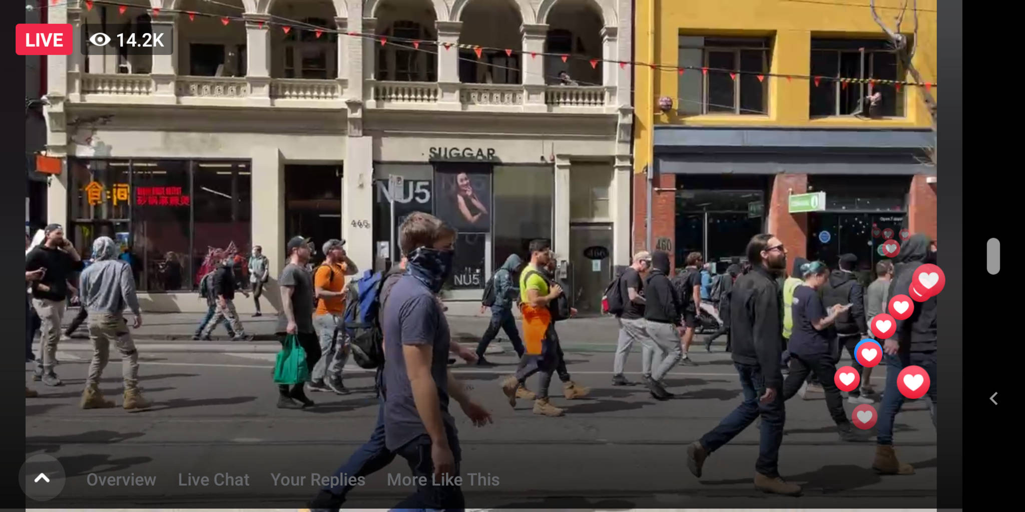 Yours truly caught on a Facebook Live stream taking pictures out of a Framework window (top right), as all sorts of anti-vaxxers, anti-lockdowners, sovereign citizens, and QAnon nutters walk past
