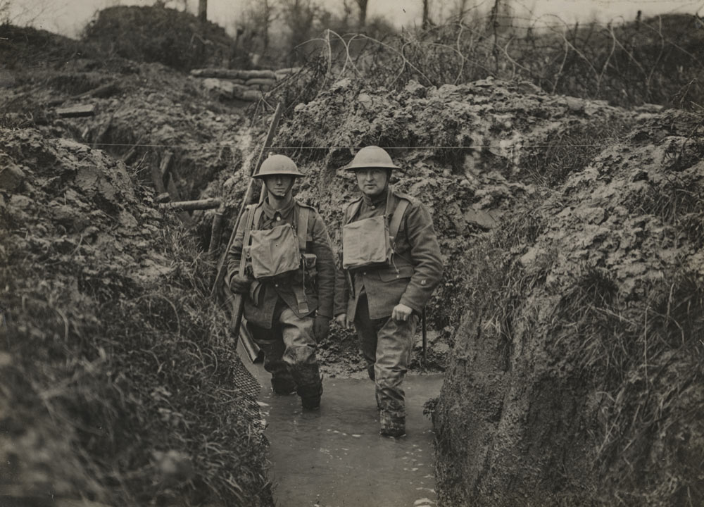 Soldiers in a water-logged WWI trench