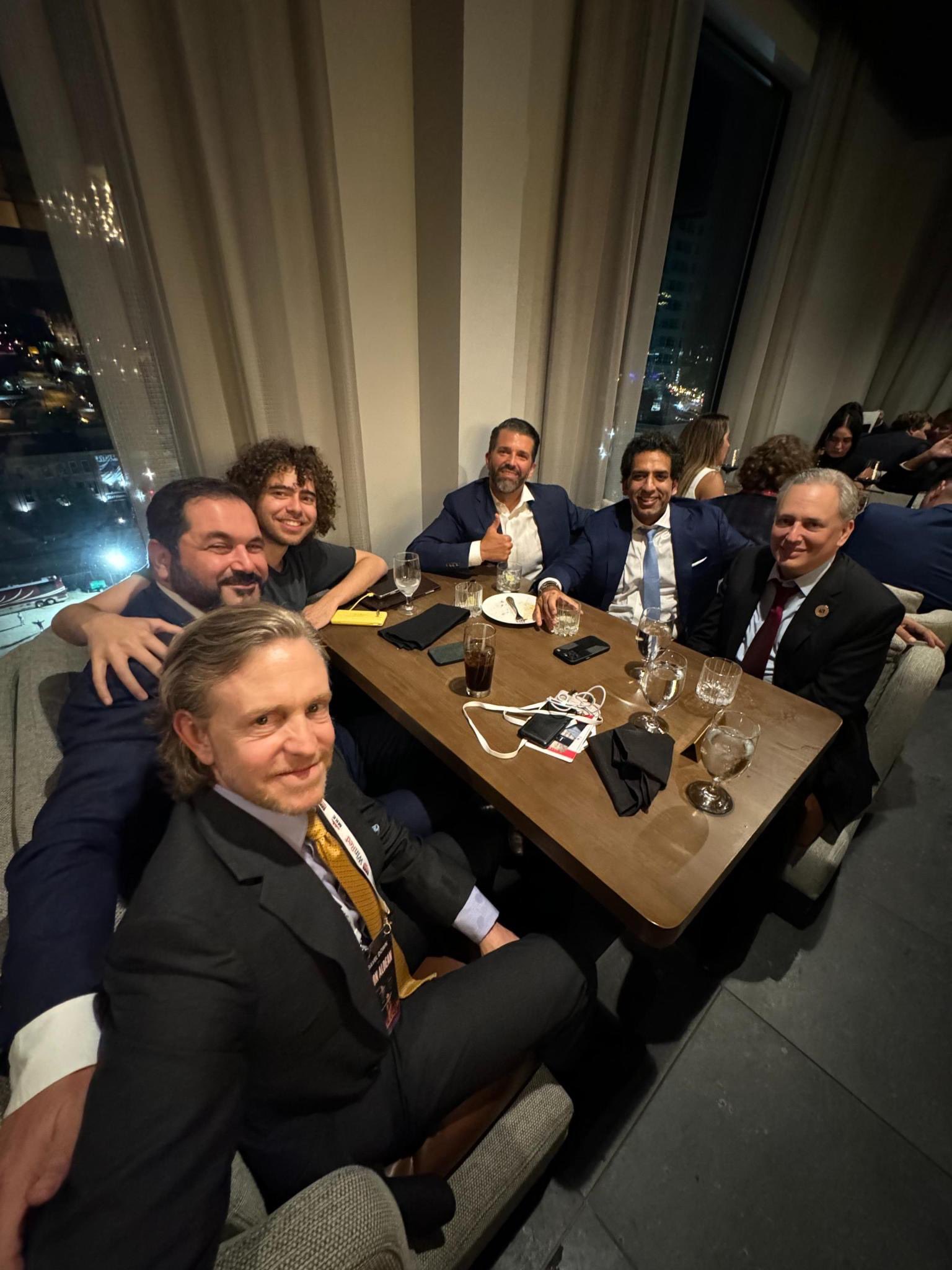 Coplan and others sitting around a table