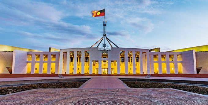 The Aboriginal flag burning atop Parliament House