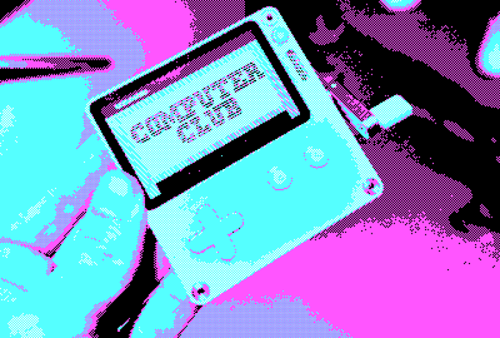 A photo of the Playdate, showing the 'Computer Club' title screen.