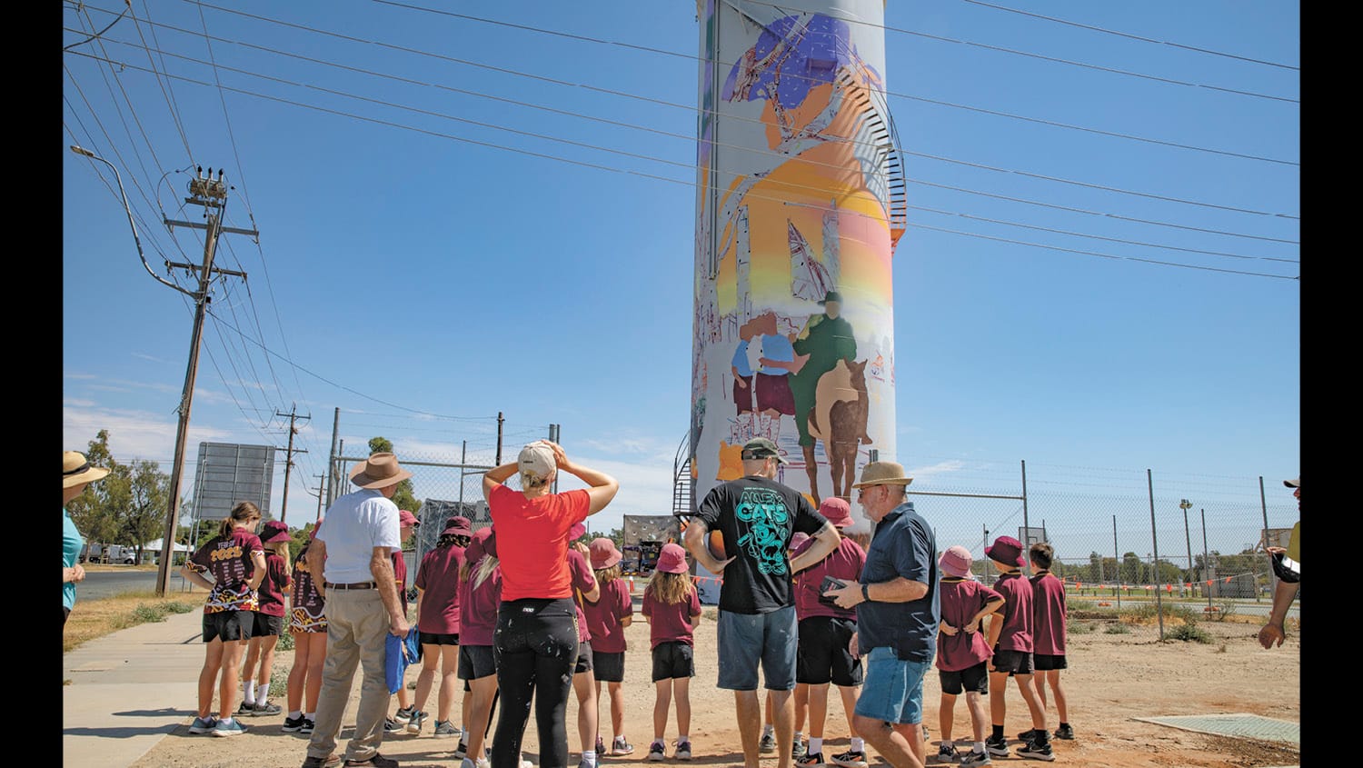 Local Kids Probe Water Tower Artist