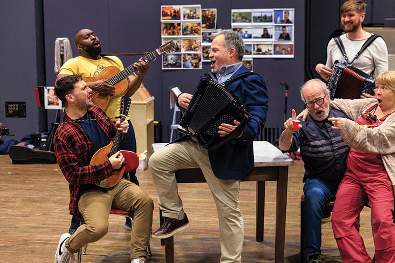 The cast of Come From Away in rehearsal.