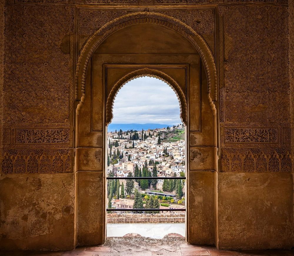 Open notebook with a pressed leaf and coloured pencils on a desk