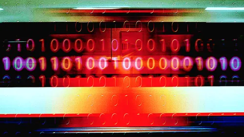 Moving train superimposed with colorful binary pattern