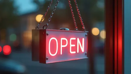 Red and white open sign hanging in window