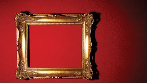 Antique gold frame on red wall