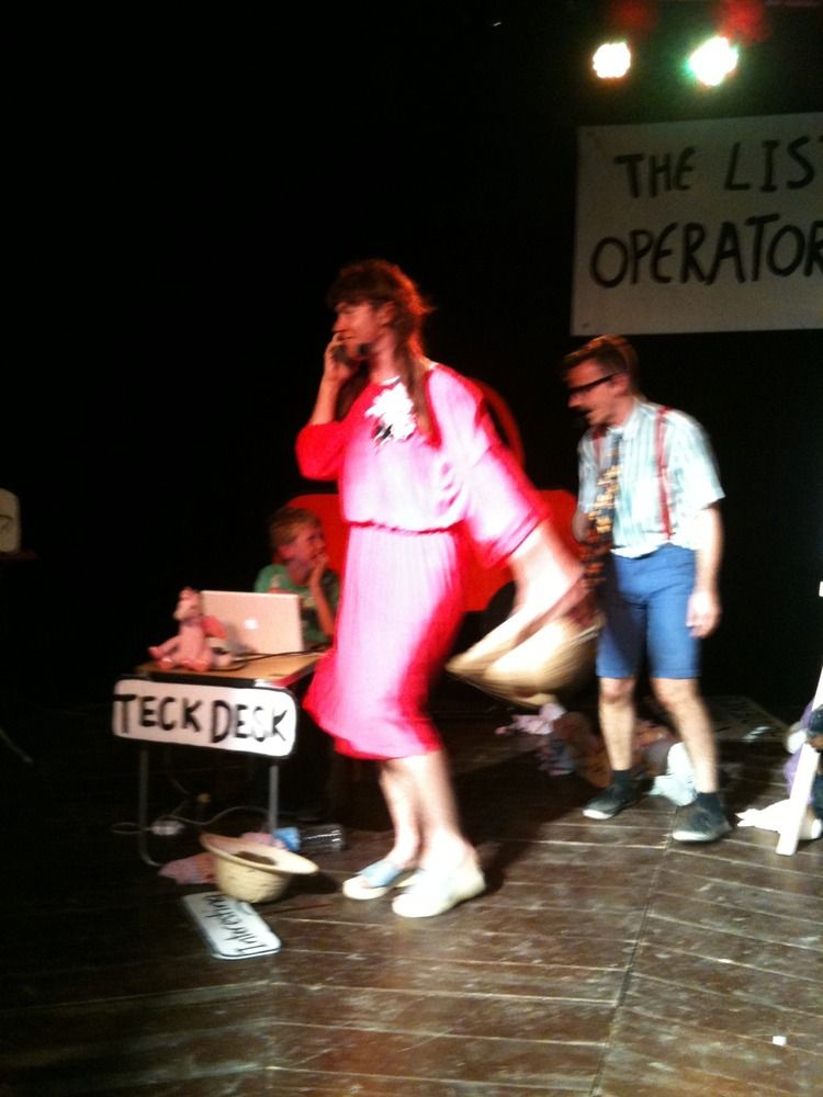 Jasper on stage doing sound effects at comedy show