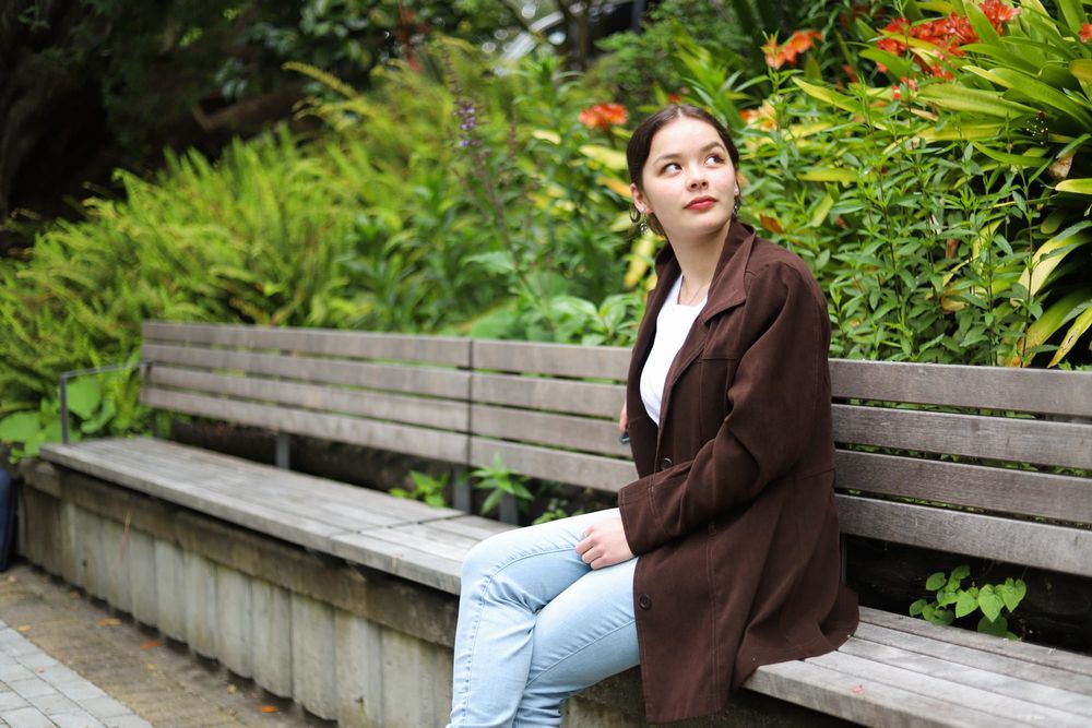 Young lady sitting in the park post image