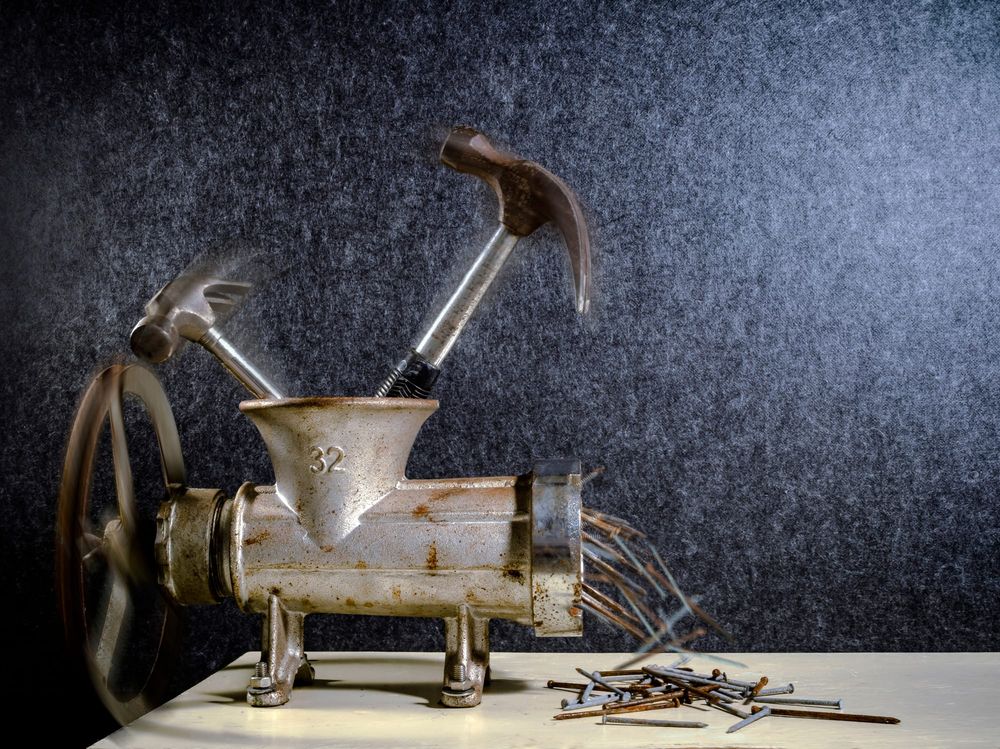 Grinder hammers nails creative concept post image