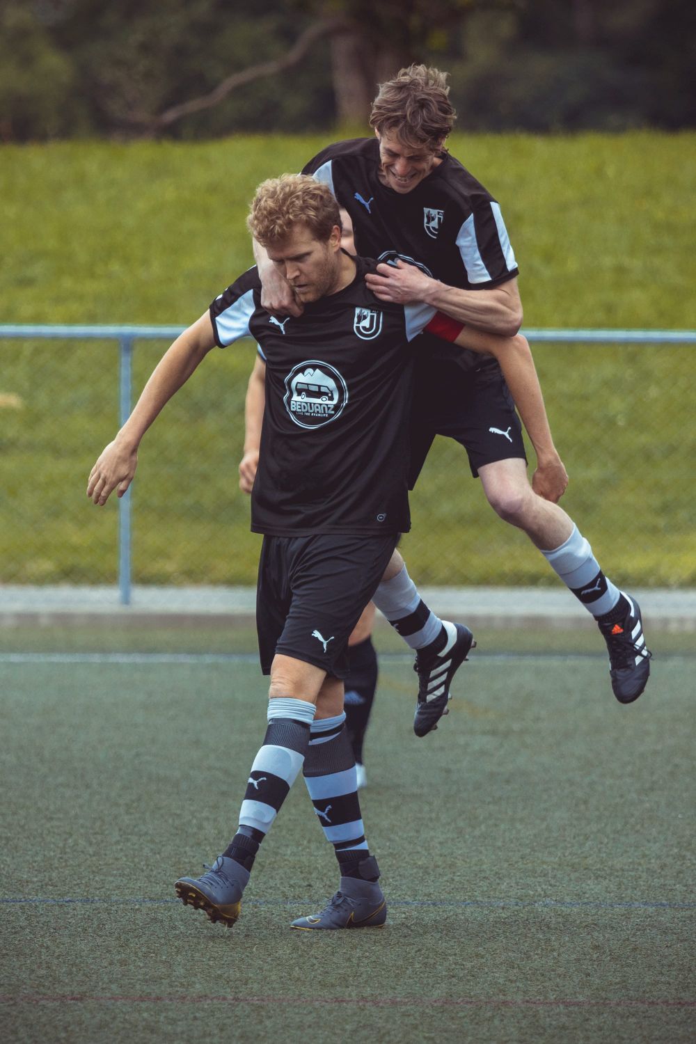 Adults playing football post image