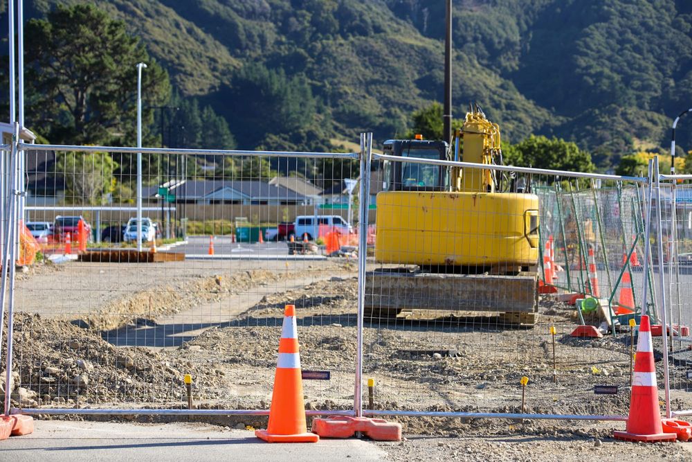 Excavator and cones at construction site post image
