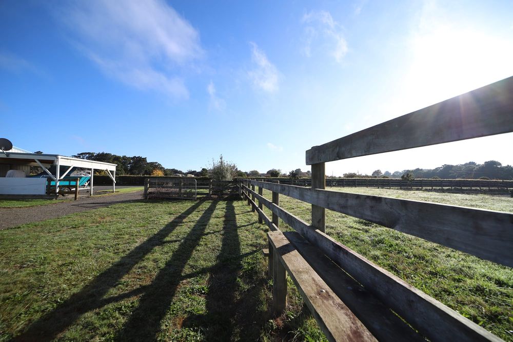 Farm fence shadows post image