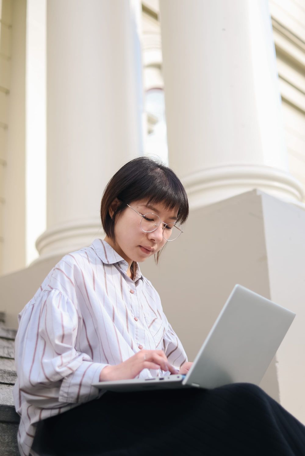 Woman studying on laptop post image