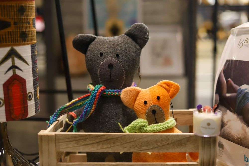 Two teddy bears in a wooden crate post image