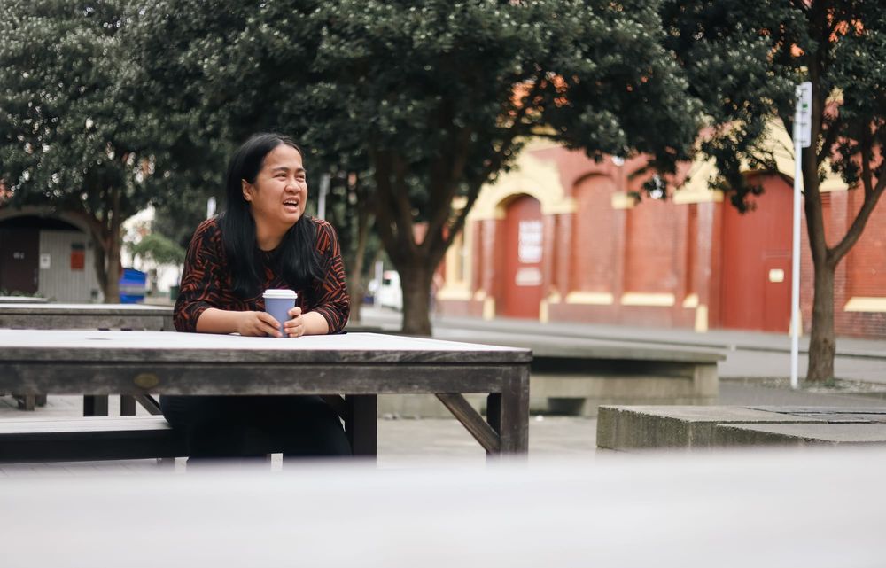 Woman enjoying coffee outdoors post image