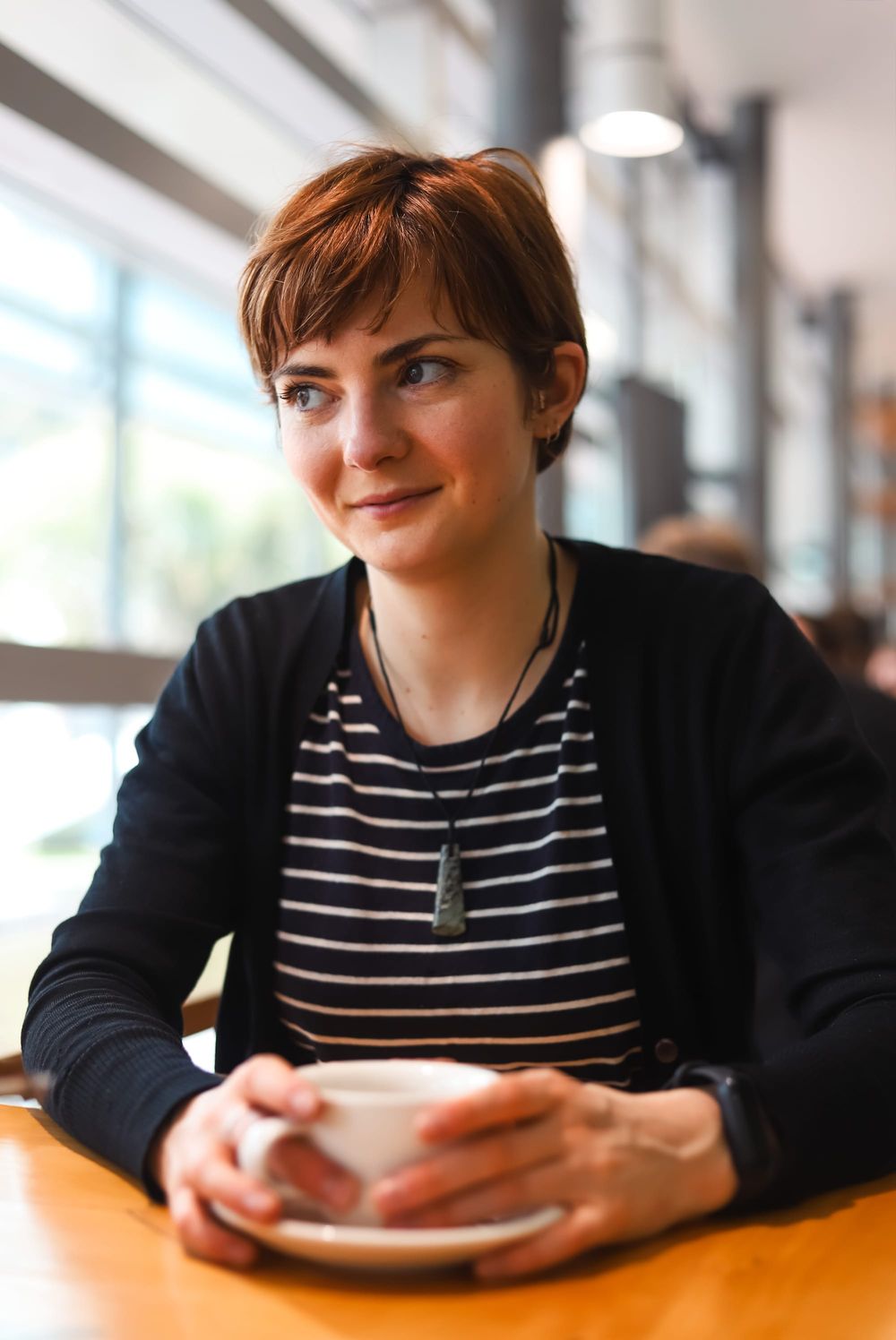 Woman holding coffee cup post image