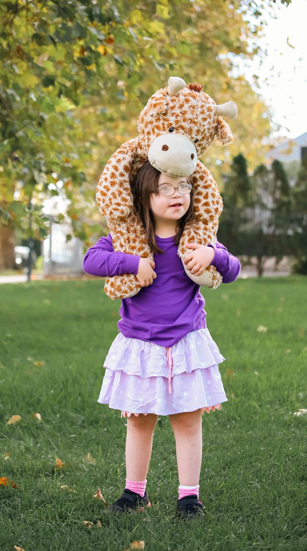 Child with a plush giraffe post image