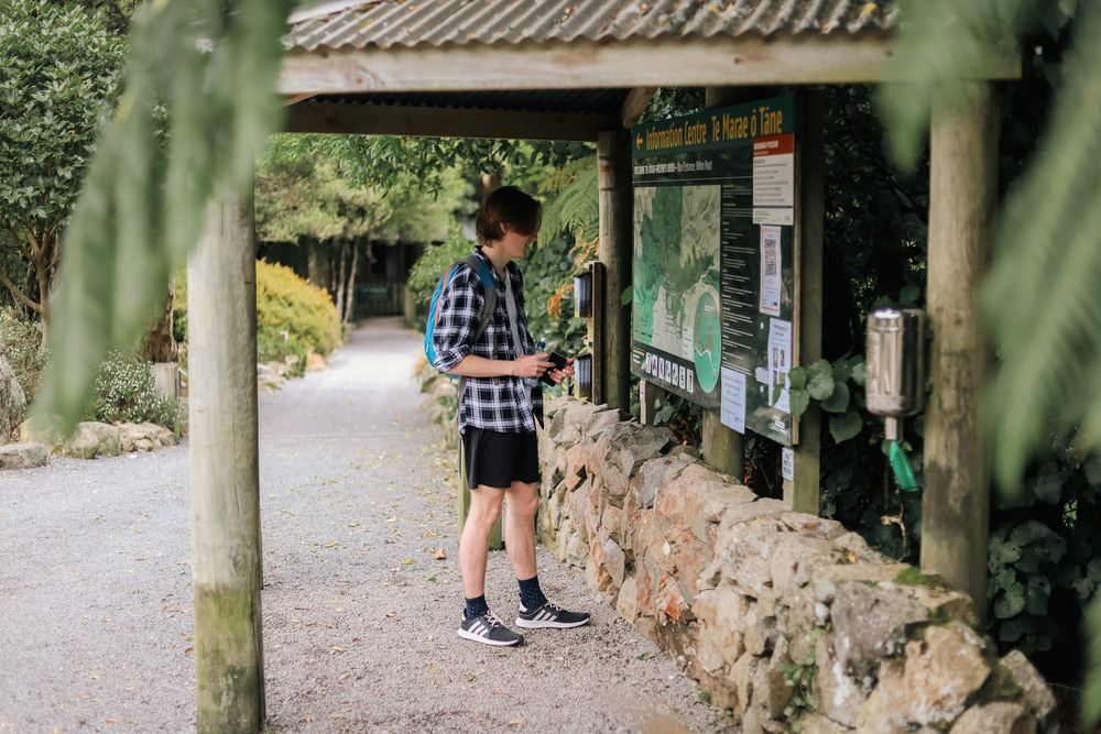 Young man reading the trail map post image