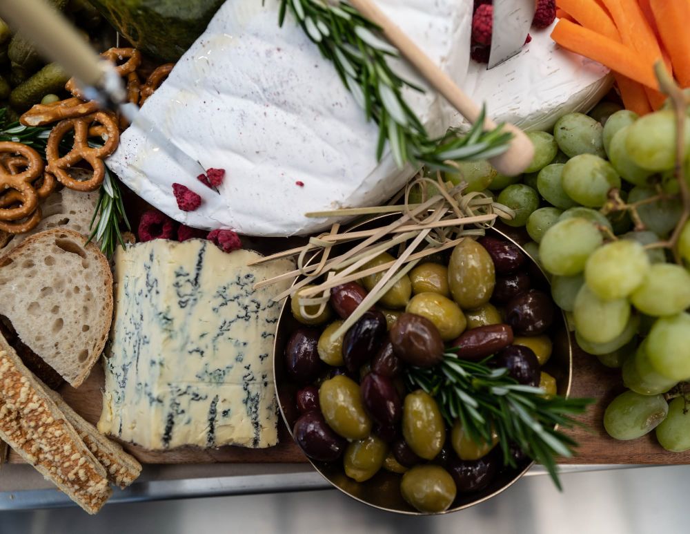 Board with cheese, olives, and fruit post image