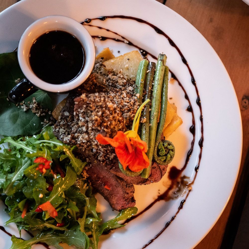 Gourmet plated dish with meat and greens post image