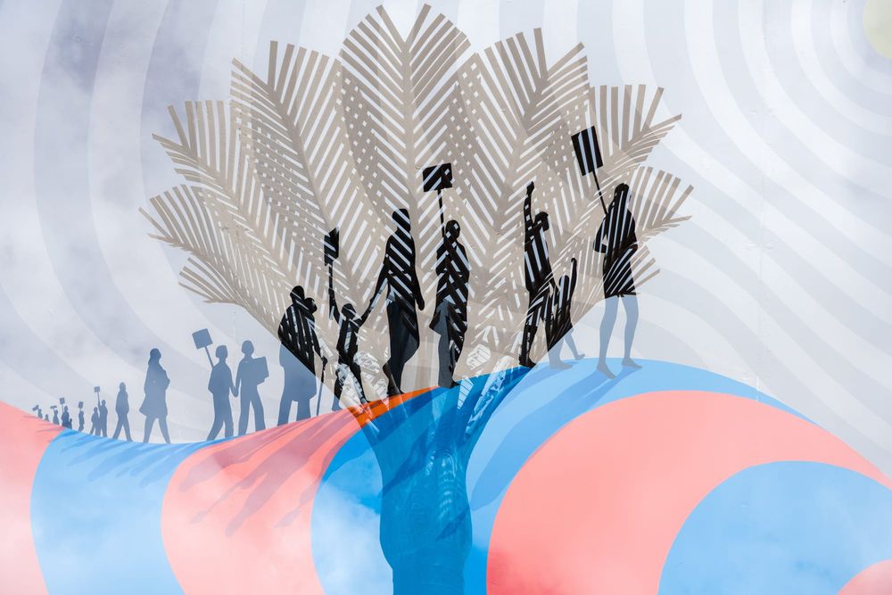 People walking through a palm post image