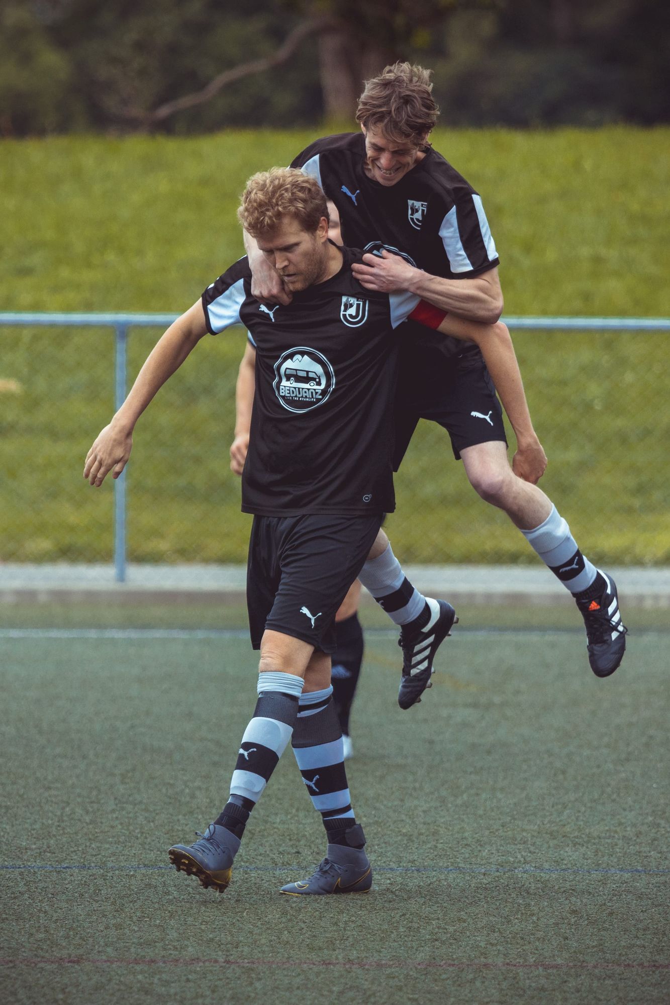 Adults playing football