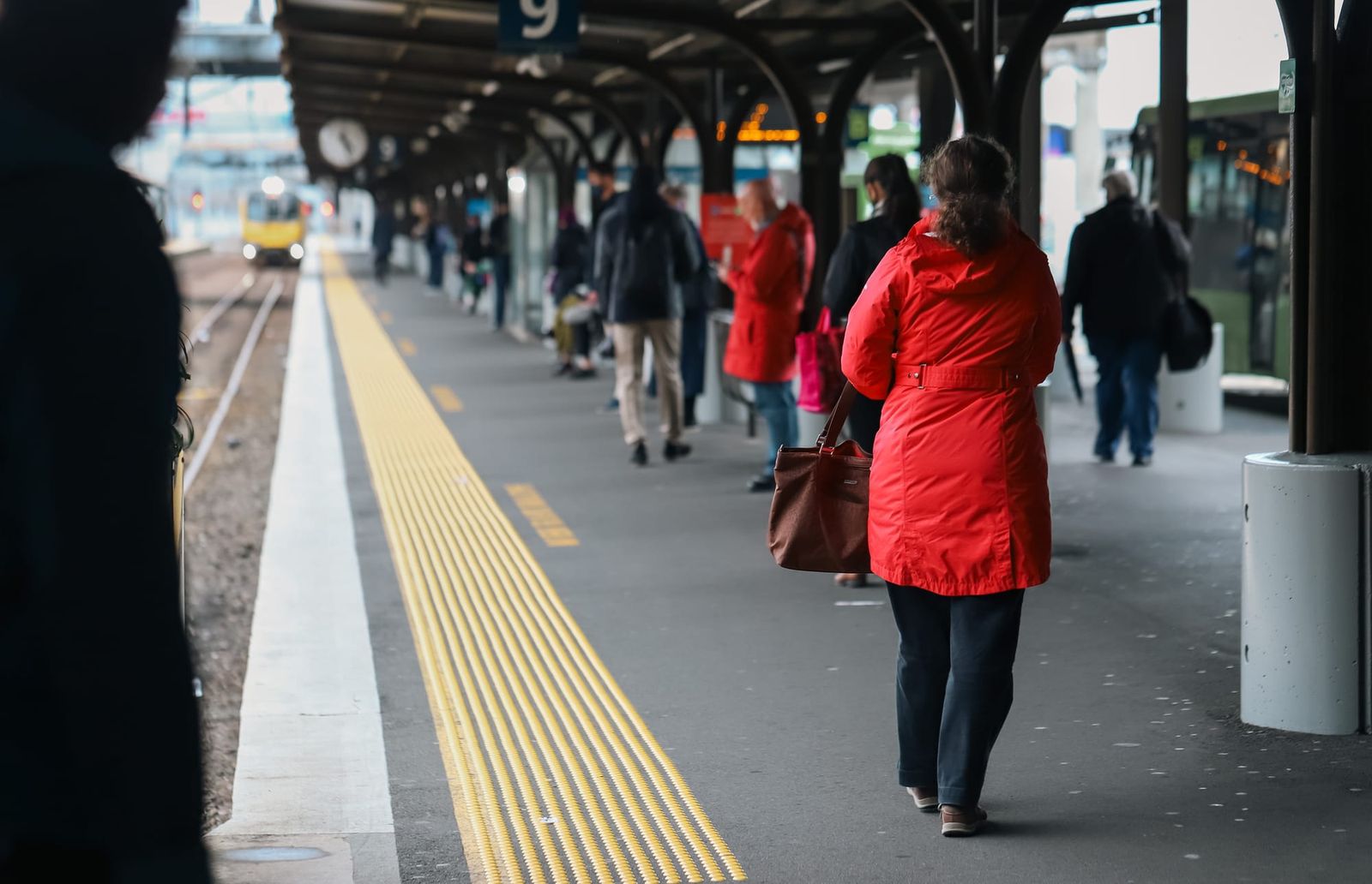 Commuters waiting at train station platform