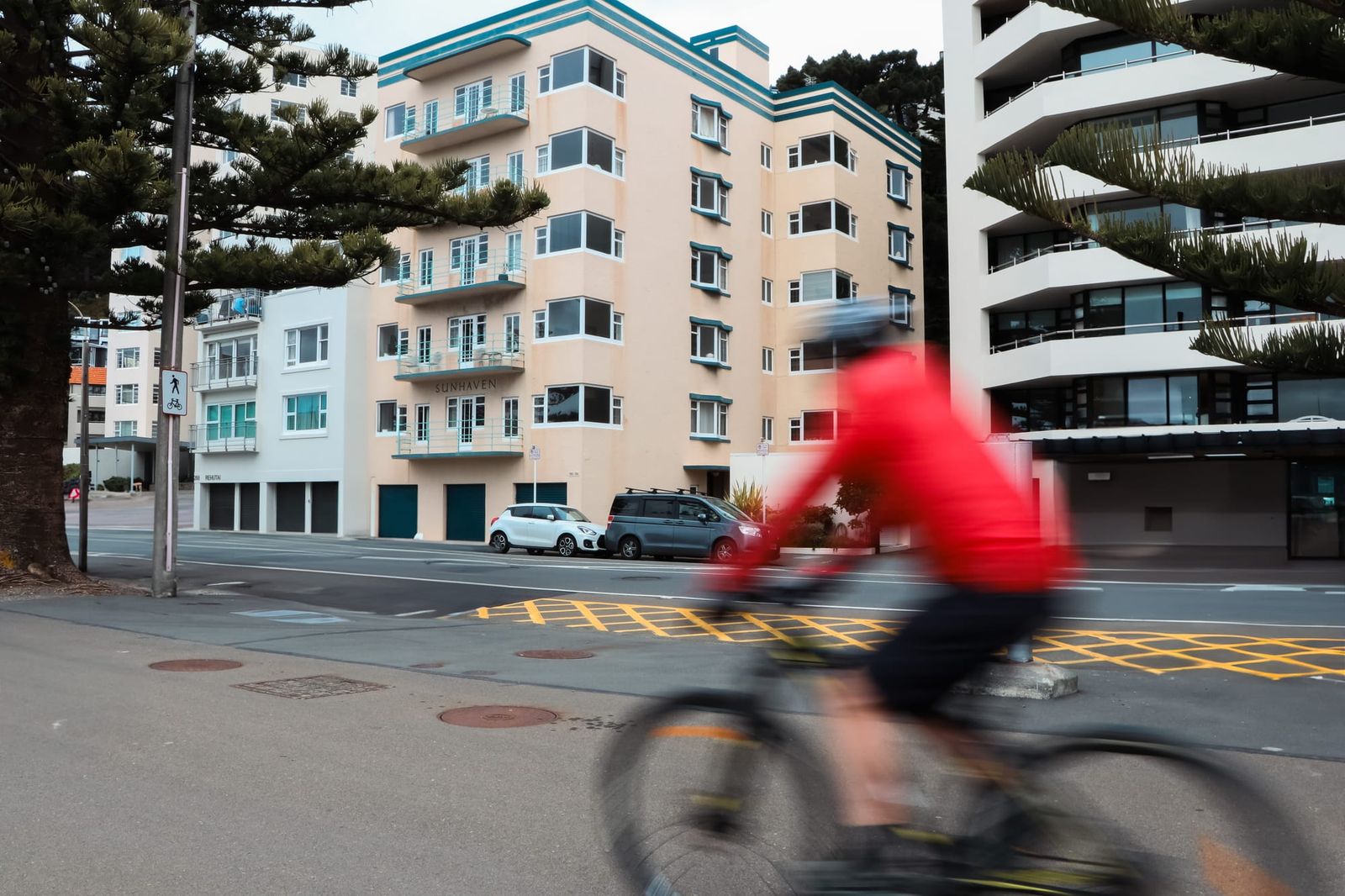 Cyclist passing apartments