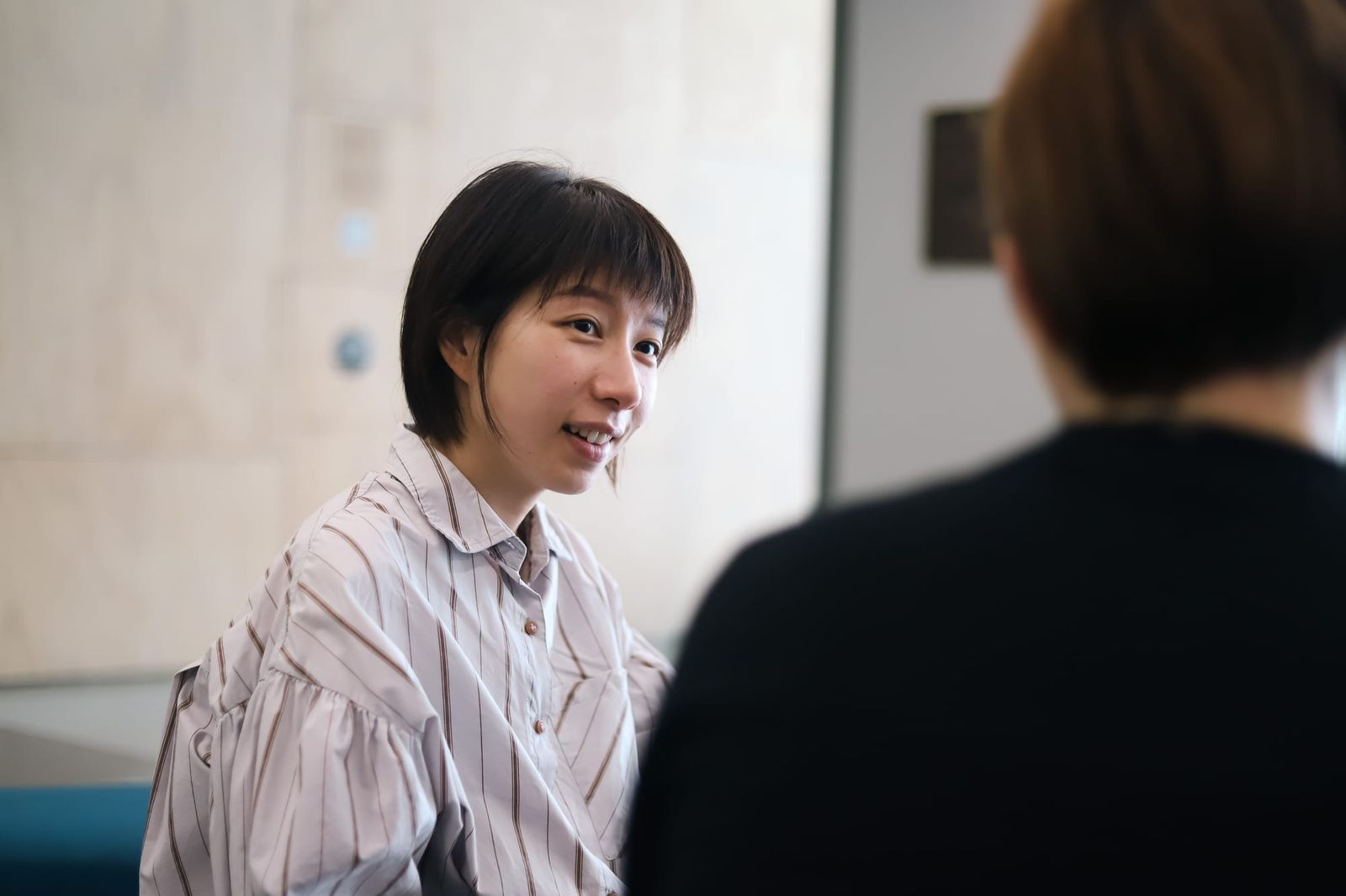 Woman smiling in conversation