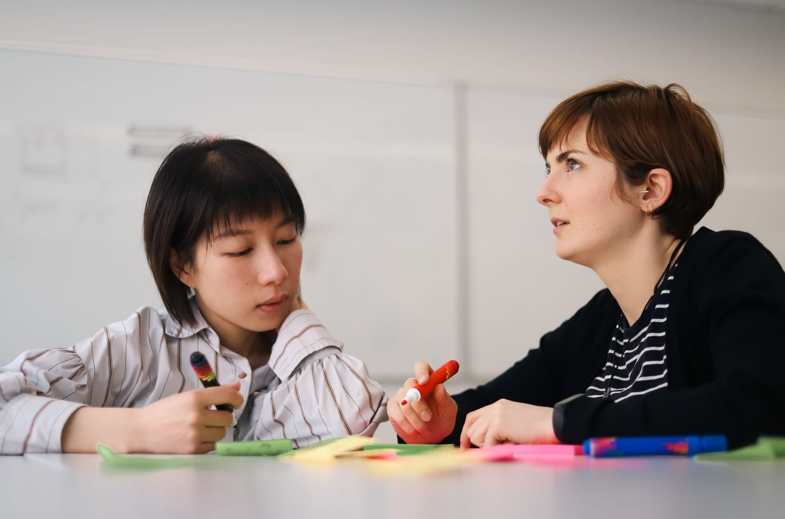 Team members writing ideas during a workshop