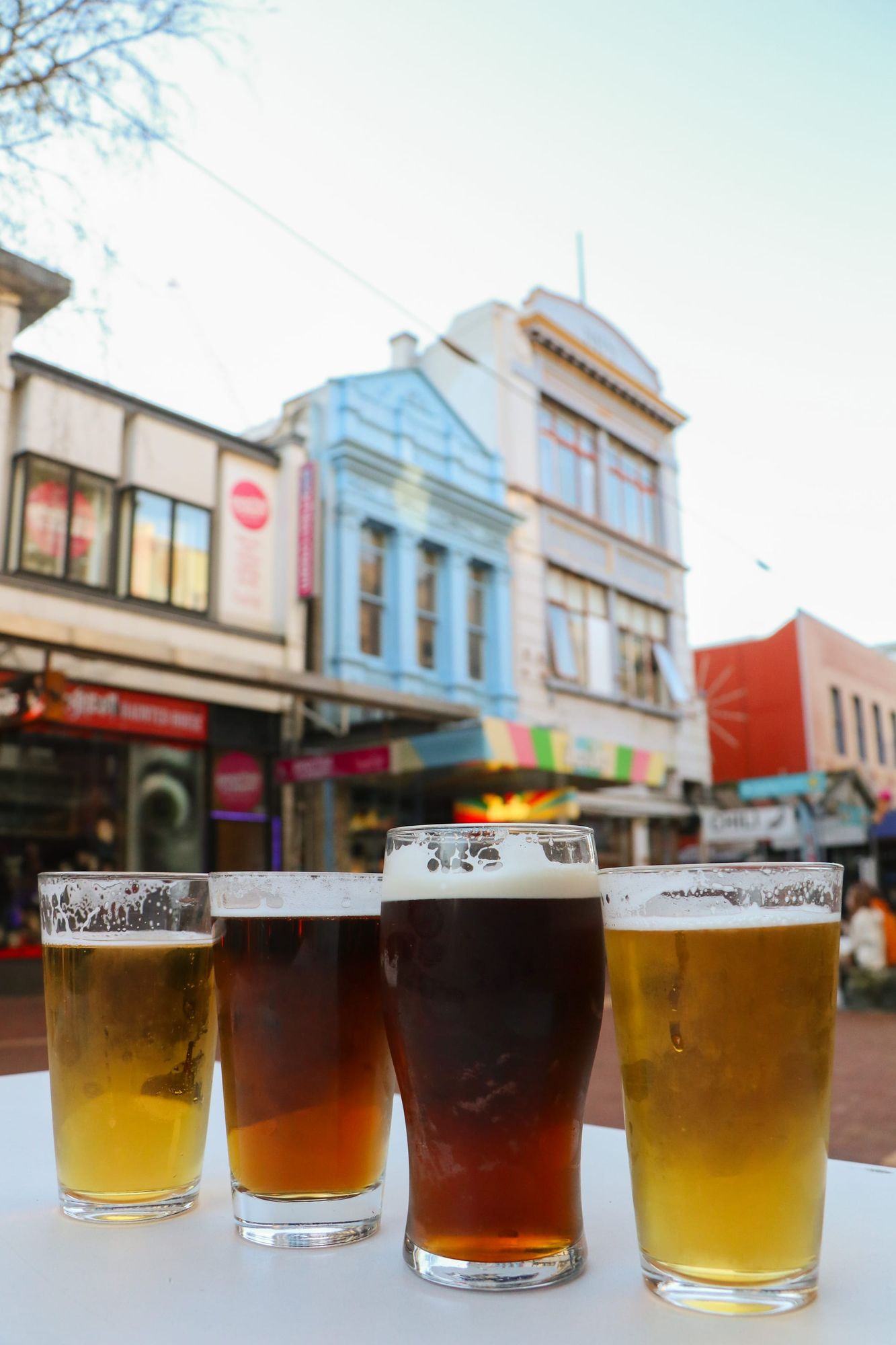 Four glasses of beer on table