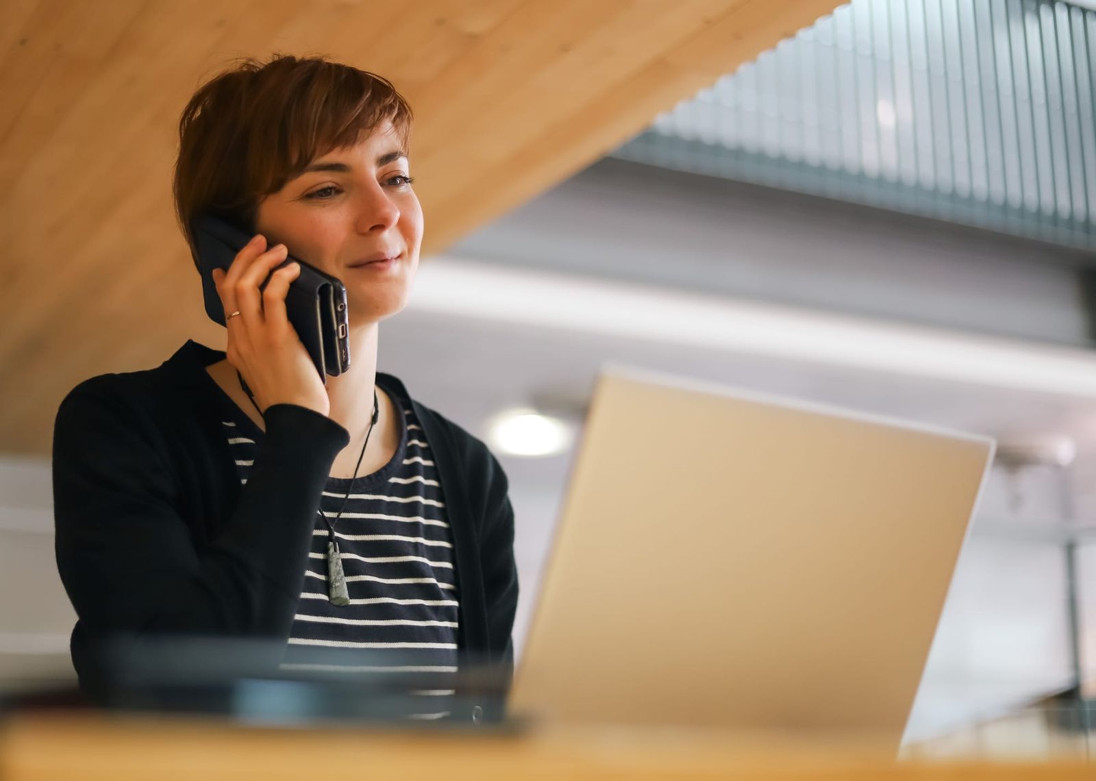 Professional woman smiling during phone call