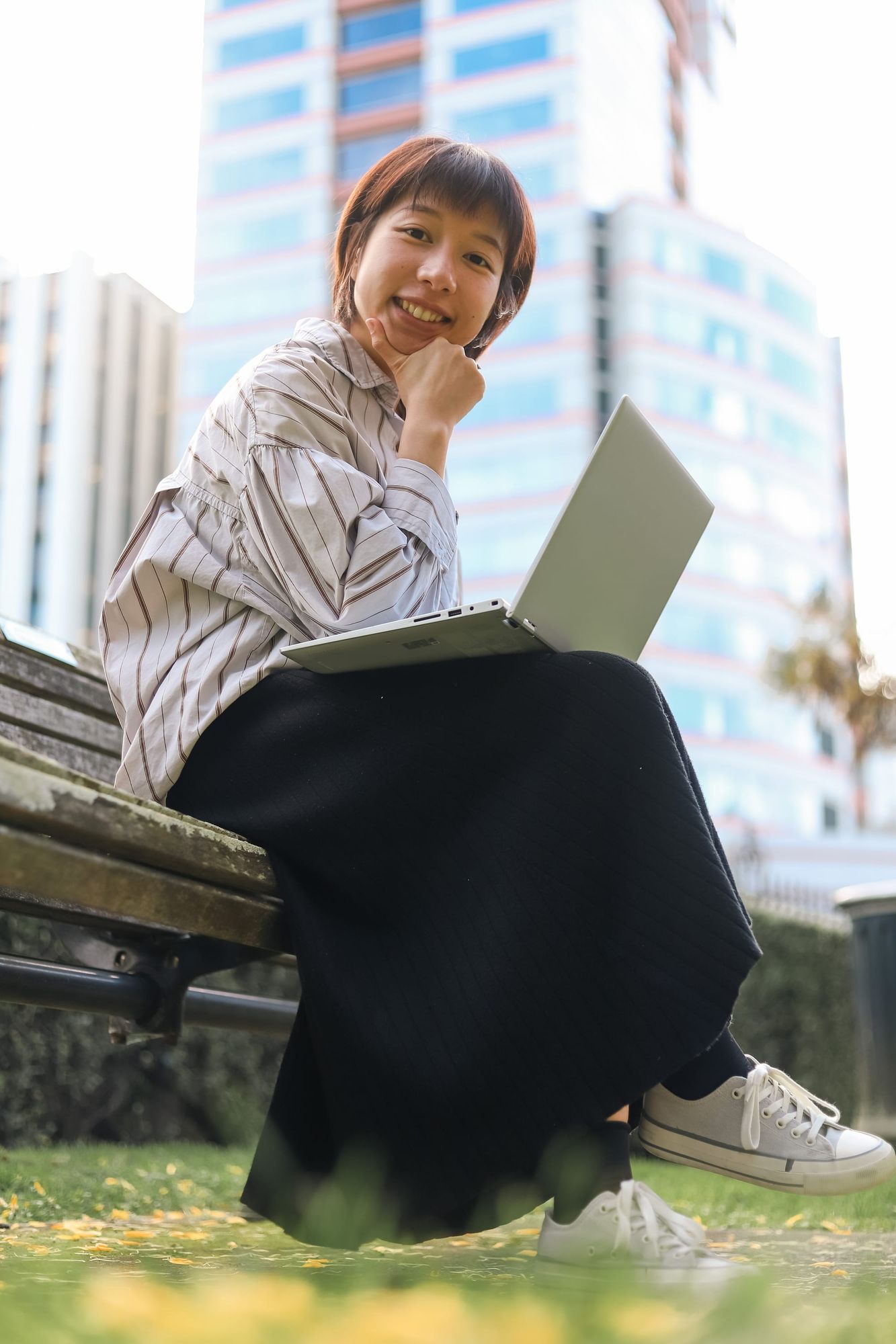 Woman smiling while working outside