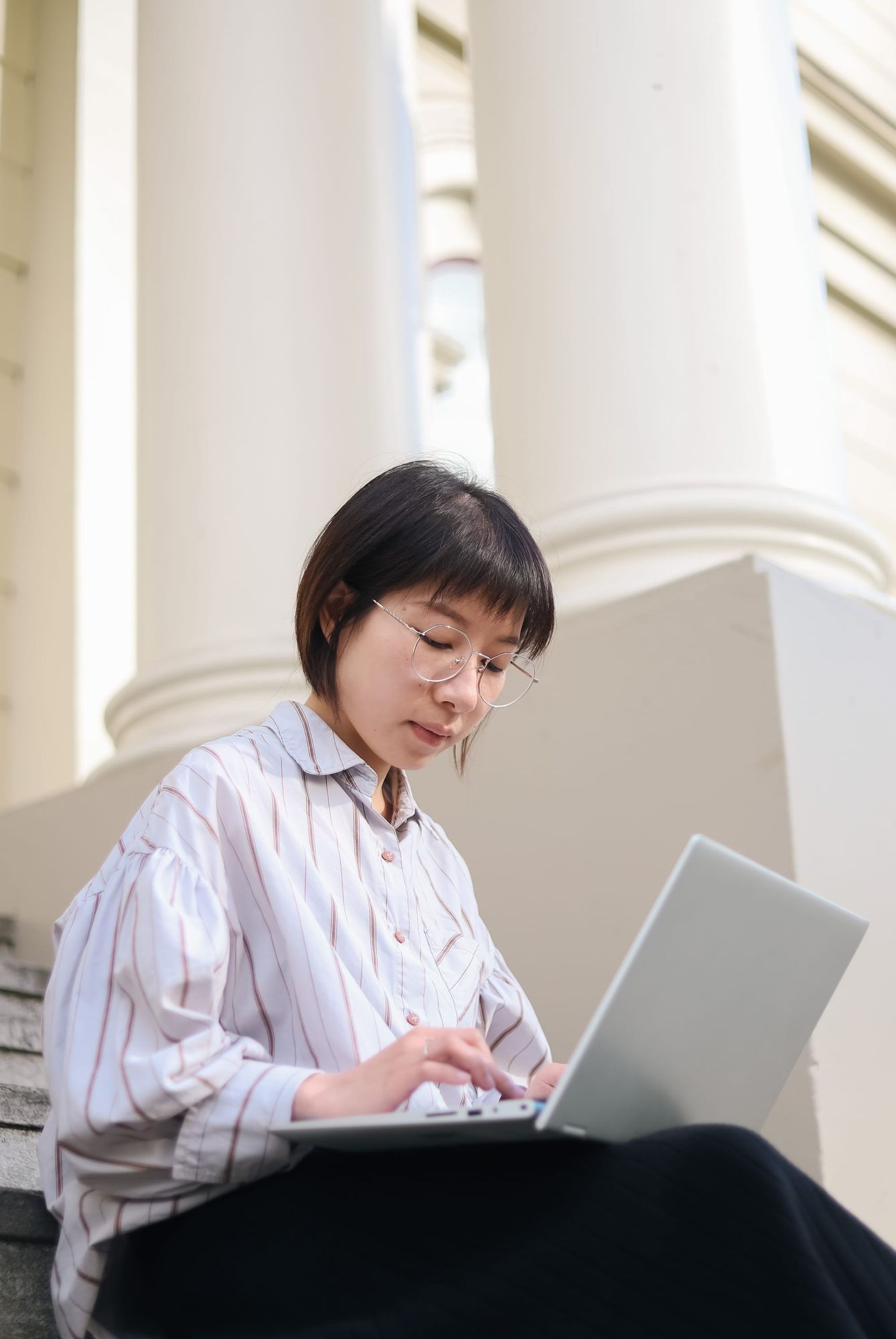 Woman studying on laptop
